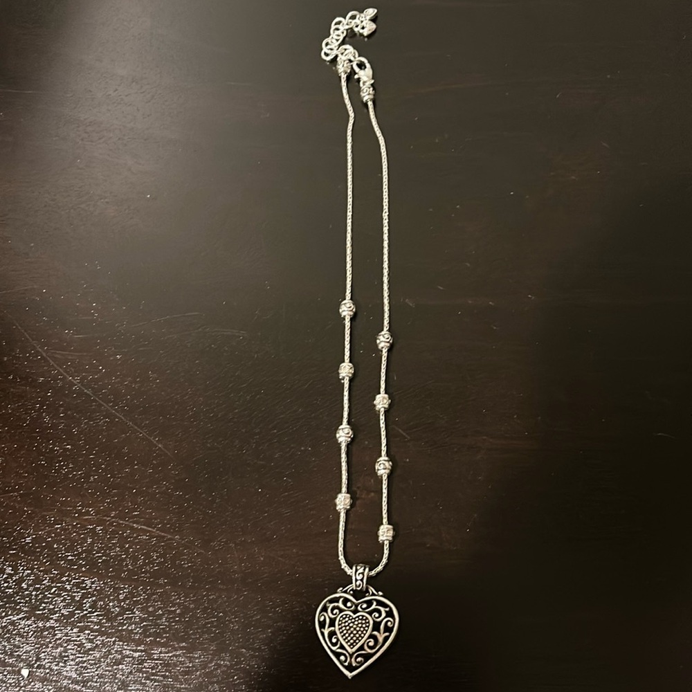 Brighton reversible heart necklace. Silver tone. Heart shaped box included.